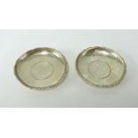 A pair of silver Hong-Kong dollar bowls, diameter 9cm.