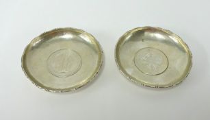 A pair of silver Hong-Kong dollar bowls, diameter 9cm.