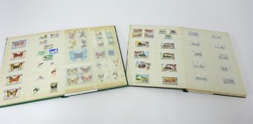 Two albums of 20th century stamps, subject Trains and Butterfly's.