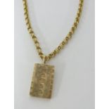 A 9ct gold ingot on yellow metal necklace unmarked, possibly 9ct, total weight 19.20g.