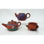 Three Yixing teapots, two lacking lids with enamel decoration.