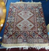 A 20th century Afghan silk rug, (Arabic motif), 90cm x 140cm.