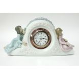 Lladro, a porcelain mantle clock, width 33cm.