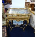 An ornate French Louis XVI gilt wood style table Vitrine on stand.