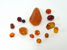 A small collection of amber pendants and stones.