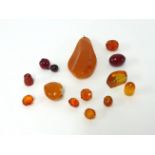 A small collection of amber pendants and stones.