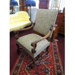 An 18th century style walnut framed open elbow chair with upholstered seat.