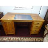 A good modern office desk fitted with cupboard and drawers with leather top together with a matching