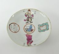 A Chinese porcelain saucer dish decorated with warriors and panels of text, underglaze marks,