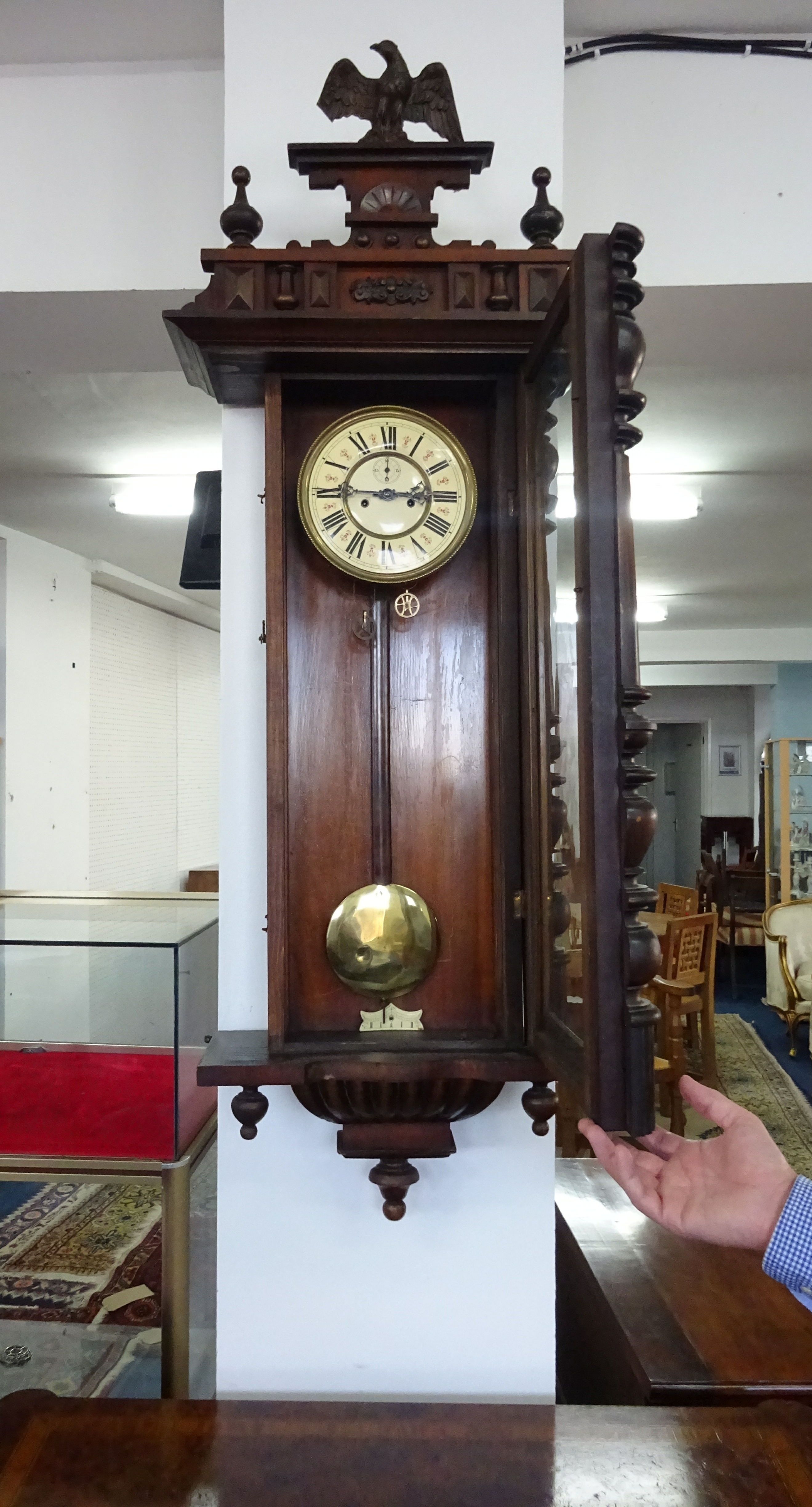 A Victorian Vienna style walk clock with two train movement, in a carved mahogany case, mounted with