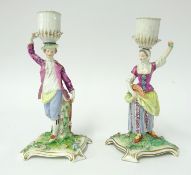 A pair of 18th century Meissen candlesticks, 'The Gardeners'