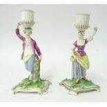 A pair of 18th century Meissen candlesticks, 'The Gardeners'