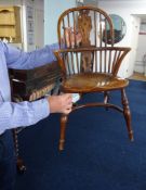 A reproduction child’s Windsor elbow chair by White Rose Furniture, height 68cm