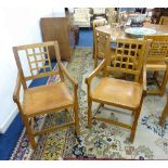 A pair of carved oak 'Mouseman' style lattice back elbow chairs, by Knight Furniture of Yorkshire (