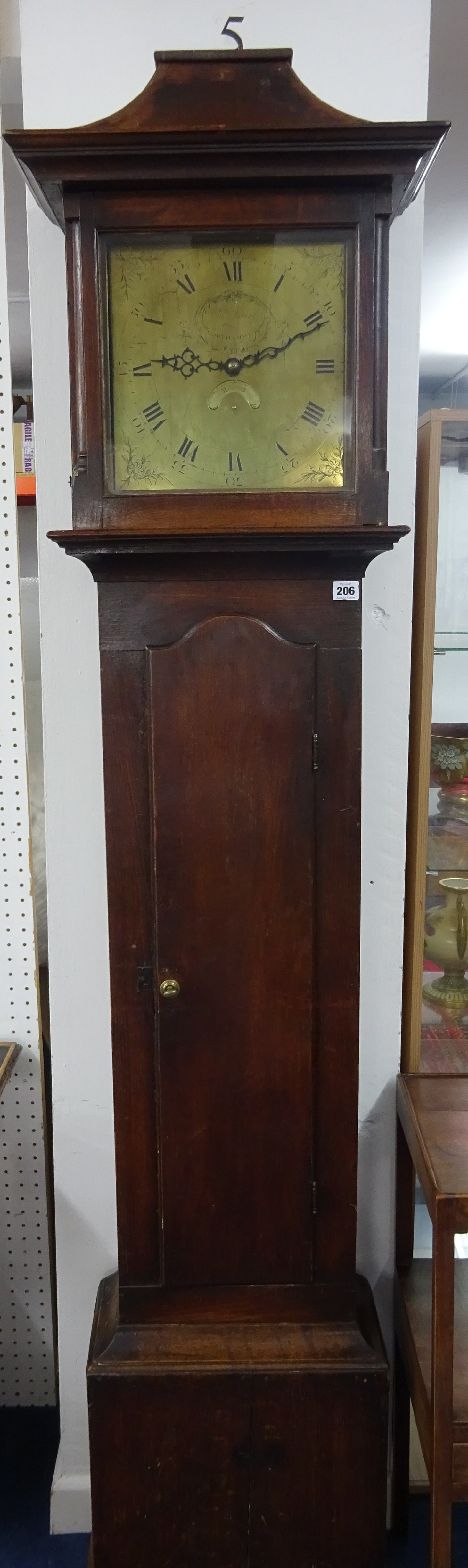 A Georgian oak longcase clock with brass dial marked Thomas Daunt, Northampton, with calendar