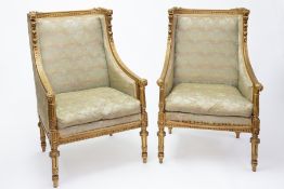 A pair of Louis XVI style gilt wood framed salon chairs, height 100cm.