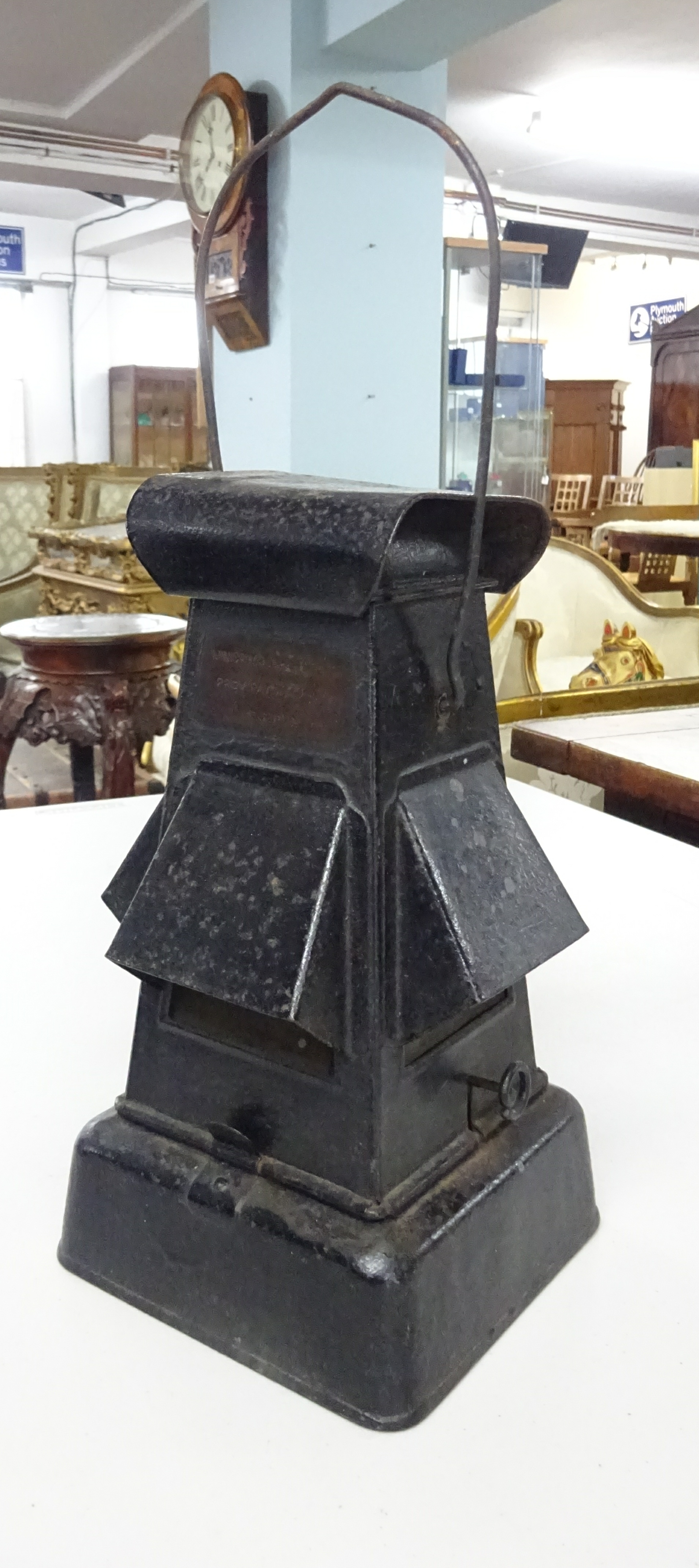 A vintage metal cross roads lantern with plaque marked 'Ministry of Supply Pattern, CGP limited',