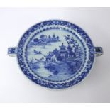 A Chinese porcelain blue and white warming plate, diameter 23cm.
