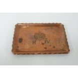 A hammered copper pin tray marked H.IV with crest, 12cm x 9cm.
