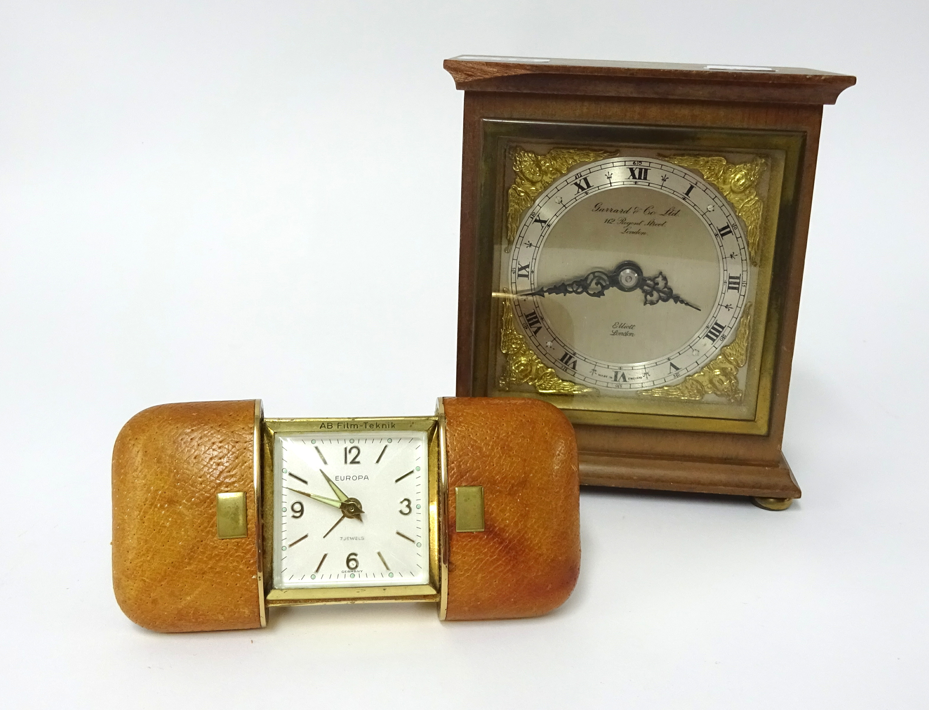 An Elliott mantle clock with dial marked 'Garrard & Co' of London, height 15cm, together with a