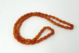 A small amber bead necklace, length approx. 54cm.