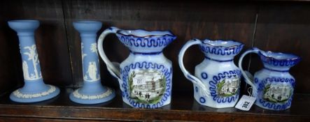 A Devonware Jardiniere on stand together with three graduated Victorian style jugs, and a pair of