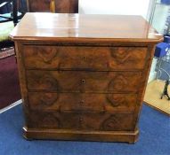 A 19th century continental walnut chest fitted with four long drawers, width 79cm, height 74cm.