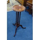 A reproduction mahogany tripod candle stand, height 66cm.