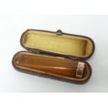 Early 20th century amber cheroot cigarette case.