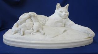 A large white marble sculpture, 'Cat Feeding Her Kittens', signed and dated, 'E. FREMIET 1863', 25.