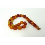 An amber bead necklace, graduated beads, length 50cm.