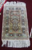 A 20th century Afghan silk prayer rug, 94cm x 60cm.