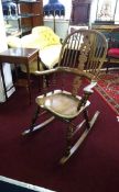 White Rose furniture (Yorkshire), a traditional style rocking chair, carved with 'White Rose'