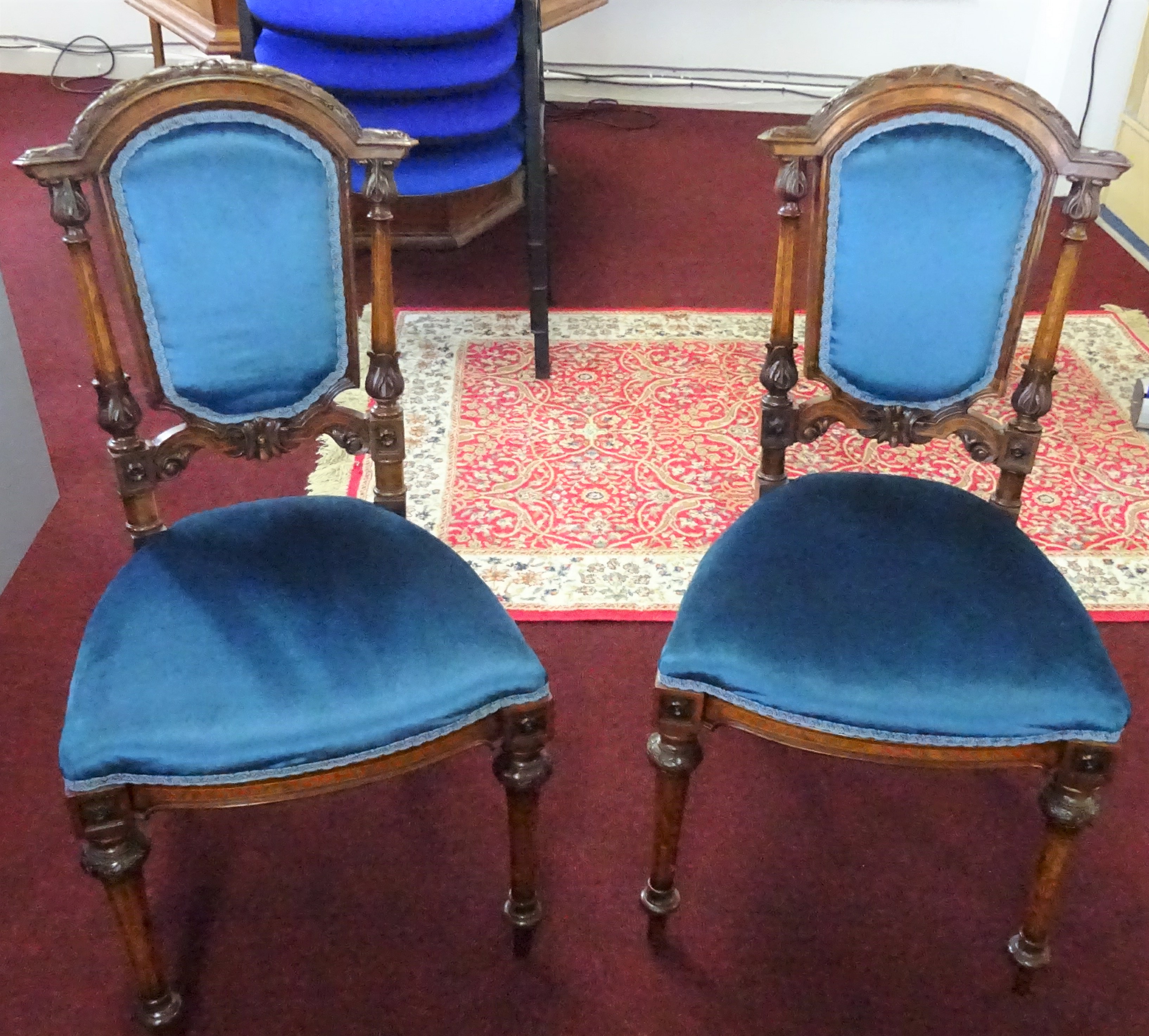 A pair of Victorian mahogany and burr walnut inlaid parlour chairs.