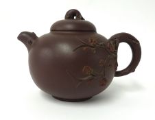 A Yixing dark brown moulded small teapot, height 10cm.