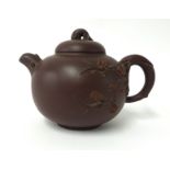 A Yixing dark brown moulded small teapot, height 10cm.