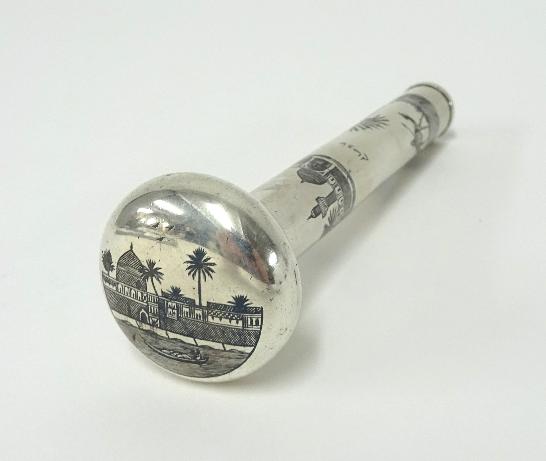 A silver Iraqi parasol handle with Neillo decoration, 13cm.