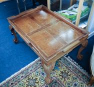 Hardwood coffee table on claw ball feet with gallery.