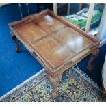 Hardwood coffee table on claw ball feet with gallery.