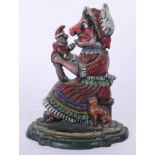 Cast iron door stop modelled as Punch and Judy, height 28cm