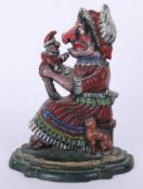 Cast iron door stop modelled as Punch and Judy, height 28cm