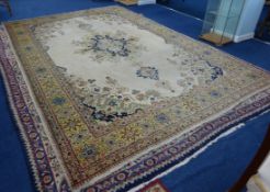 Antique Persian Tabriz style carpet, stylised floral design on camel ground, 391cm x 256cm.