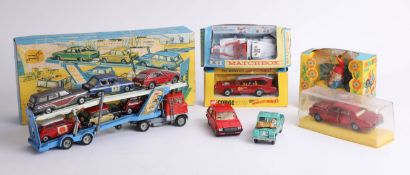 A collection of boxed and loose diecast model cars, including a boxed Corgi transporter 'Gift Set