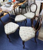 Four Victorian balloon back dining chairs.