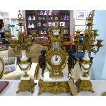 A large continental gilt and marble style three piece clock garniture set decorated with cherubs,