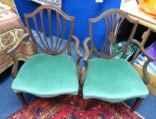 Two mahogany framed elbow chairs.