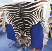 A Zebra skin rug.