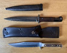 A bayonet with a 17.5cm long stiletto blade, A Puma knife with 16.5cm long blade and a full tang