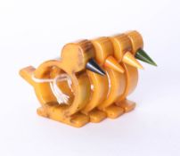 Set of four novelty bakelite napkin rings.