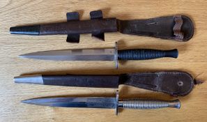 Two post WW2 Third pattern Fairbairn Sykes knives, one being made by Wilkson Sword, both blades have